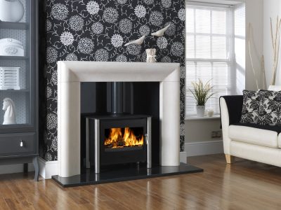 ESSE 125 wood-burning stove with heat-resistant glass ceramic door panel, fire on.