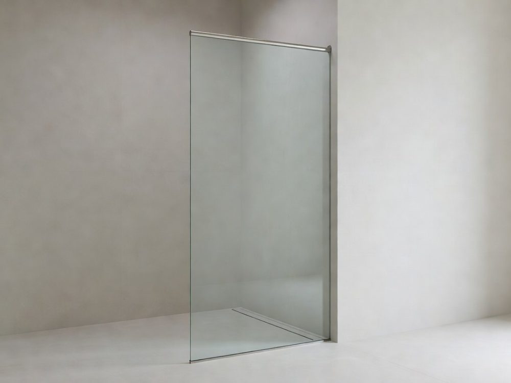 Frameless toughened wet room glass panel cut to size, wall fixed with a slim support bar