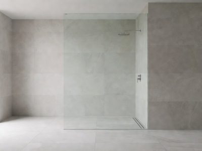 Frameless toughened wet room glass panel cut to size, wall fixed with a slim support bar