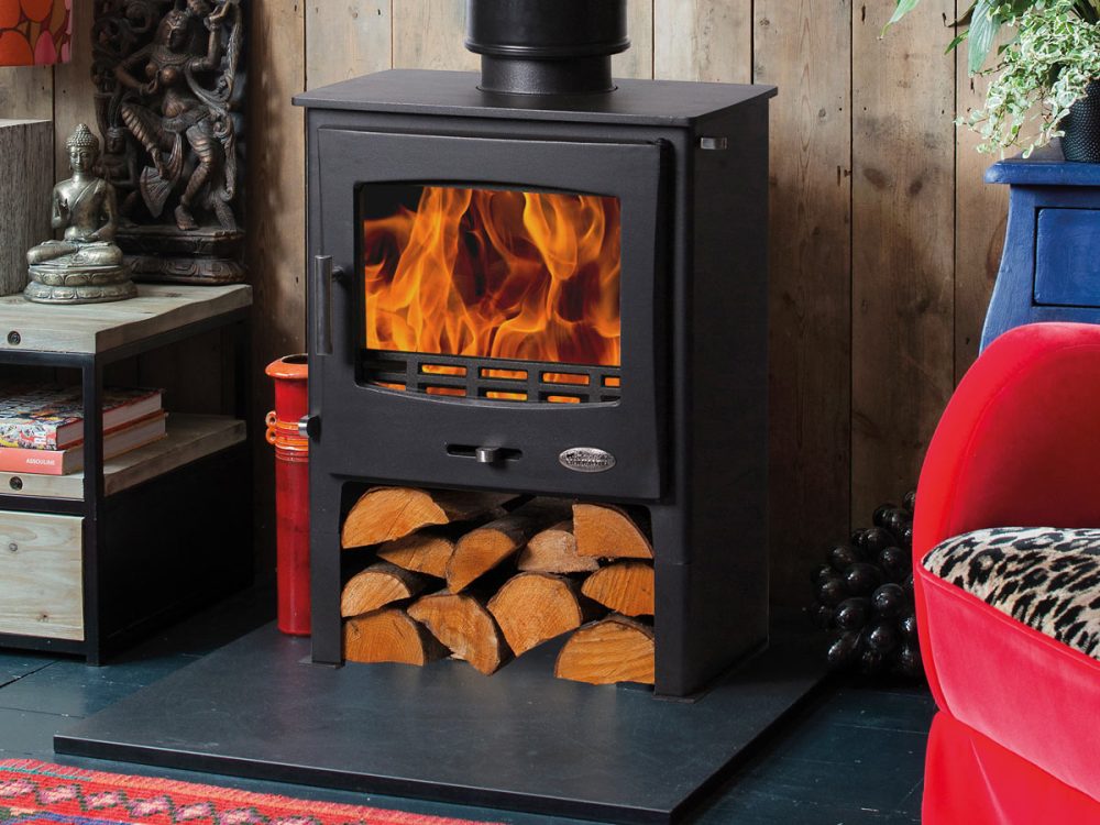 Woolly Mammoth 5 Widescreen MK1 wood-burning stove with heat-resistant glass ceramic door panel, fire on.